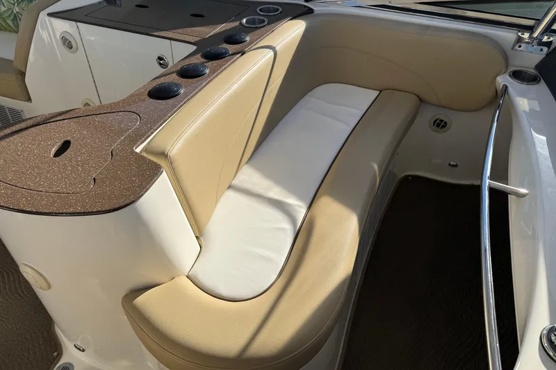 Slide: The Image of 2016 Meridian 441 boat interior with beige seating and cup holders. - 75