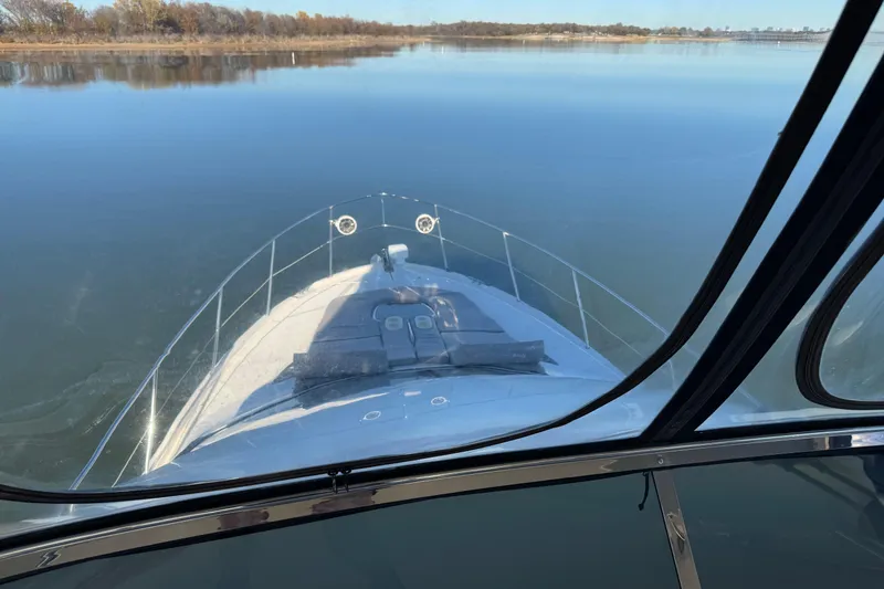 Slide: The Image of 2016 Meridian 441 yacht cruising on calm waters, view from the helm. - 77