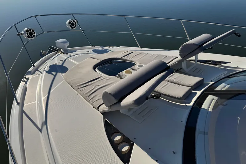Slide: The Image of 2016 Meridian 441 yacht deck with cushioned sun loungers and ocean view. - 78