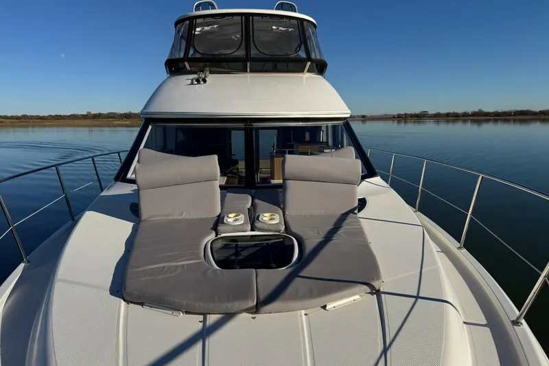 Slide: The Image of Luxury 2016 Meridian 441 yacht with sun loungers on calm water. - 79