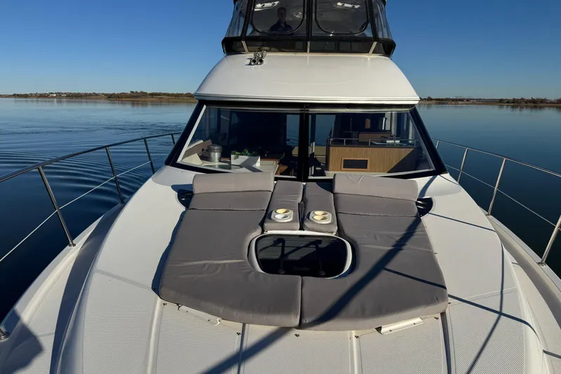 Slide: The Image of 2016 Meridian 441 yacht with sunbathing deck on calm water. - 80