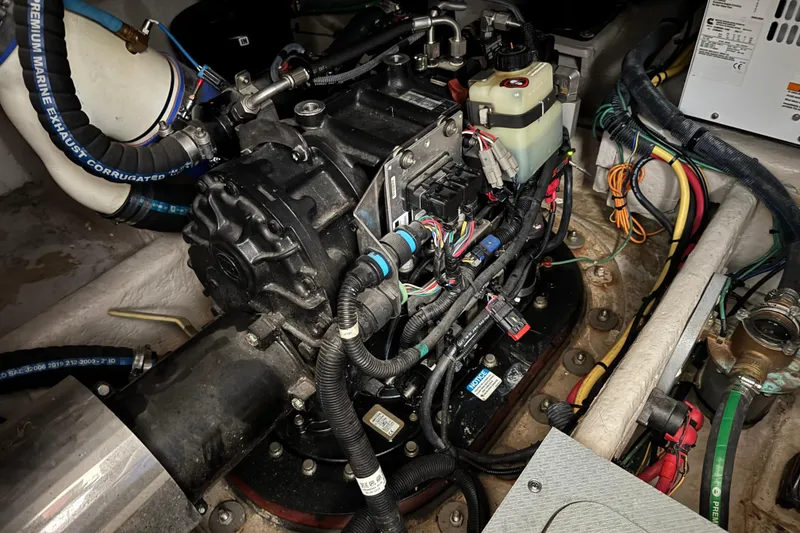 Slide: The Image of Engine compartment of a 2016 Meridian 441 boat, showcasing wiring and components. - 84