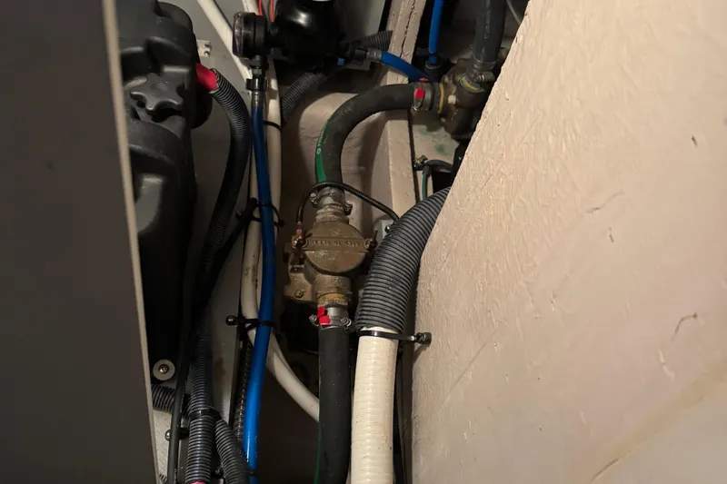 Slide: The Image of Engine compartment of 2016 Meridian 441 with visible hoses and mechanical components. - 85