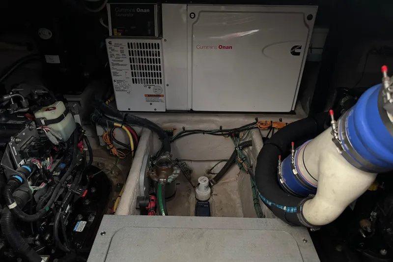 Slide: The Image of Engine room of a 2016 Meridian 441 with Cummins Onan generator and wiring. - 86