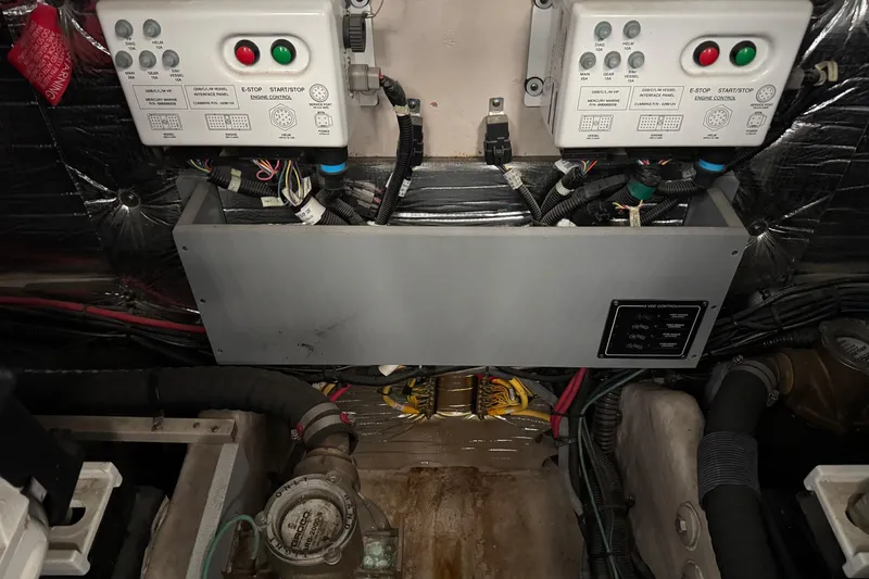 Slide: The Image of Engine room of 2016 Meridian 441 yacht with control panels and wiring. - 92