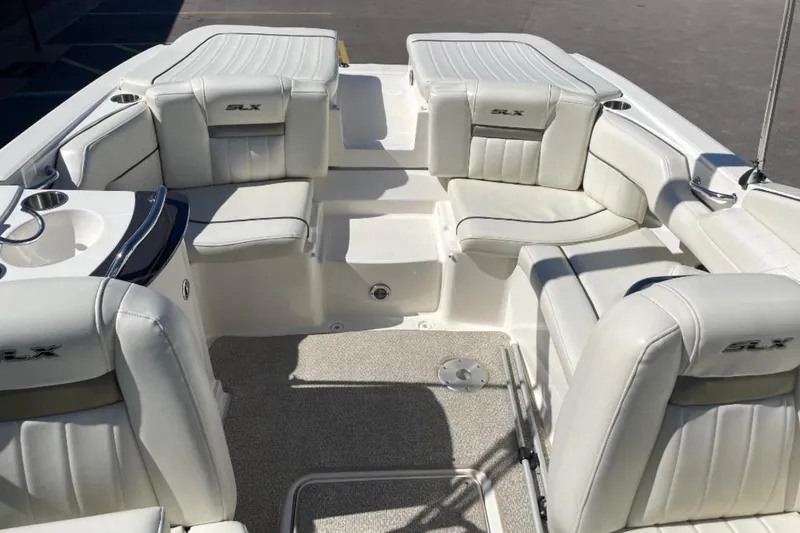 Slide: The Image of Luxurious interior of a 2007 Sea Ray 250 SLX boat with white leather seating. - 11