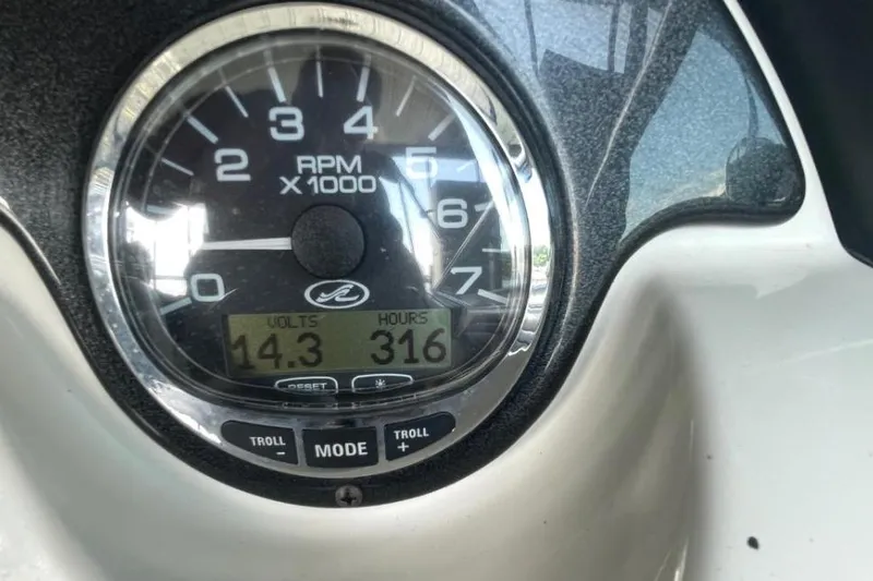 Slide: The Image of Close-up of 2007 Sea Ray 250 SLX tachometer showing 14.3 volts and 316 hours. - 12
