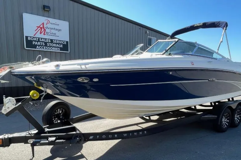 Slide: The Image of 2007 Sea Ray 250 SLX boat on trailer at Premier Advantage Marine. - 2