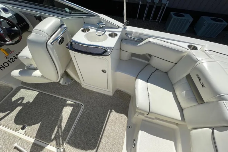 Slide: The Image of 2007 Sea Ray 250 SLX boat interior with seating and sink area. - 4