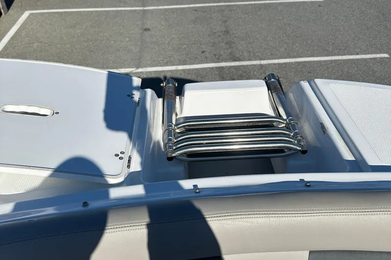 Slide: The Image of 2022 Four Winns HD5 OB boat with folded stainless steel swim ladder. - 10
