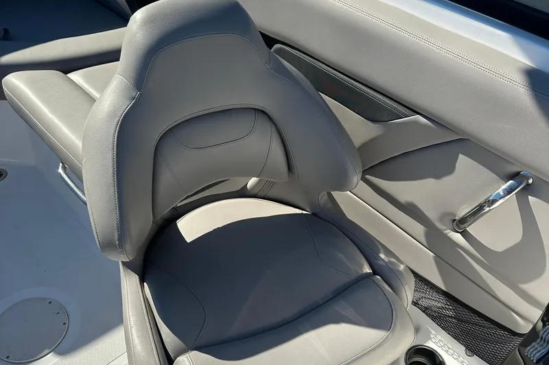 Slide: The Image of 2022 Four Winns HD5 OB boat interior with gray seating and sleek design. - 12