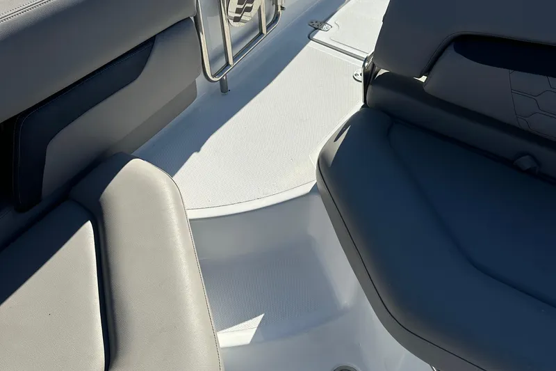 Slide: The Image of 2022 Four Winns HD5 OB boat interior with gray seating and white flooring. - 19