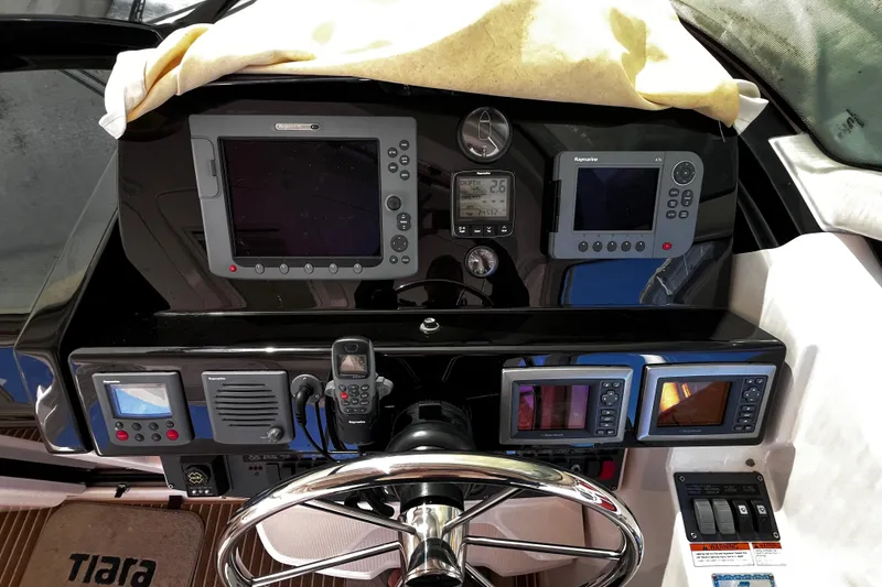 Slide: The Image of 2009 Tiara Yachts 3900 Open dashboard with navigation and control instruments. - 14