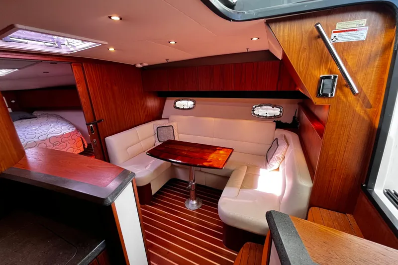 Slide: The Image of Luxurious 2009 Tiara Yachts 3900 Open interior with elegant wood and white leather seating. - 19