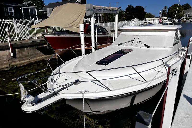 Slide: The Image of 2009 Tiara Yachts 3900 Open docked, showcasing sleek design and modern features. - 2