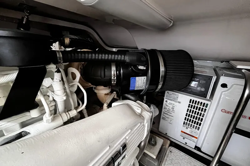 Slide: The Image of Engine room of 2009 Tiara Yachts 3900 Open, featuring Cummins generator and components. - 30