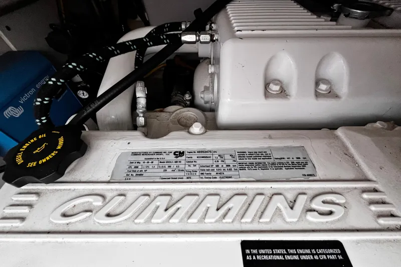 Slide: The Image of Cummins engine in 2009 Tiara Yachts 3900 Open, showcasing diesel components and specifications. - 32