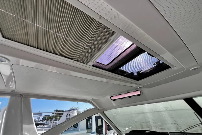 Slide: The Image of Interior view of 2009 Tiara Yachts 3900 Open with sunroof and window details. - 38