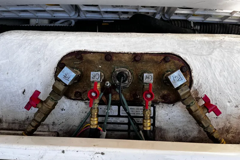 Slide: The Image of Engine compartment of 2009 Tiara Yachts 3900 Open, showing valves and connections. - 40