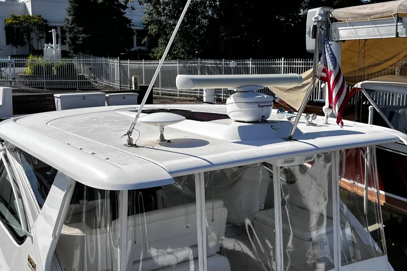 Slide: The Image of 2009 Tiara Yachts 3900 Open with radar and American flag on deck. - 41