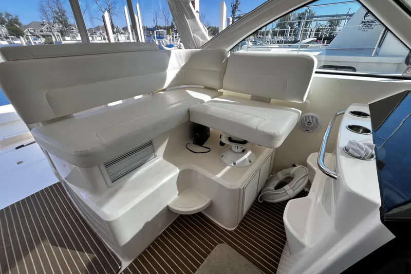 Slide: The Image of 2009 Tiara Yachts 3900 Open interior with white seating and striped flooring. - 9