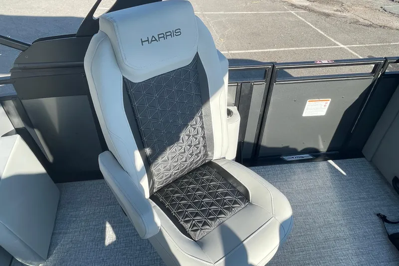 Slide: The Image of 2026 Harris Solstice 230SLDH boat seat with geometric pattern and logo. - 11