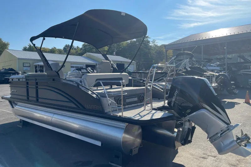Slide: The Image of 2026 Harris Solstice 230SLDH pontoon boat with canopy and Mercury outboard motor. - 6