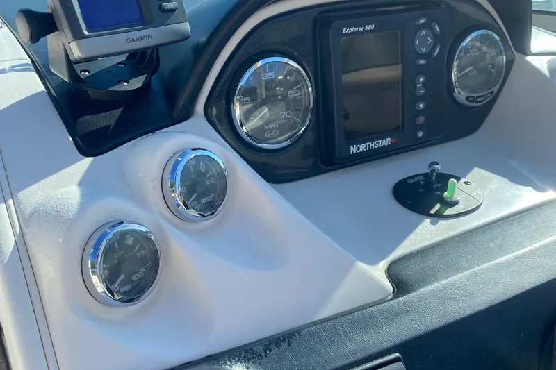 Slide: The Image of Dashboard of 2008 Sea Ray 270 SLX boat with gauges and navigation system. - 10