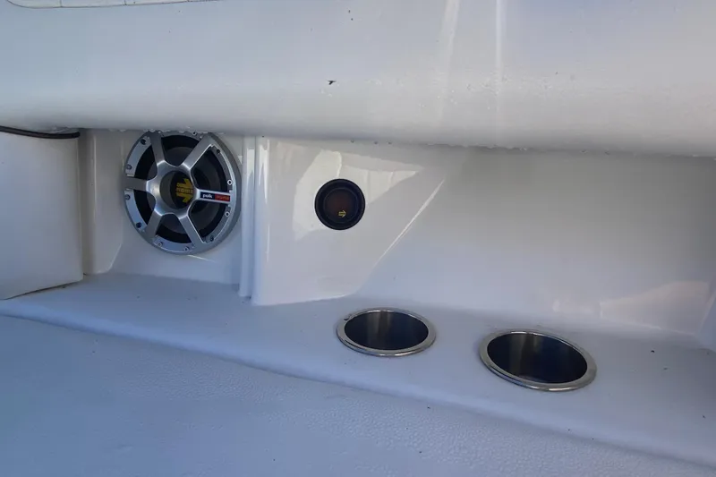 Slide: The Image of 2008 Sea Ray 270 SLX boat interior with speaker and cup holders. - 13