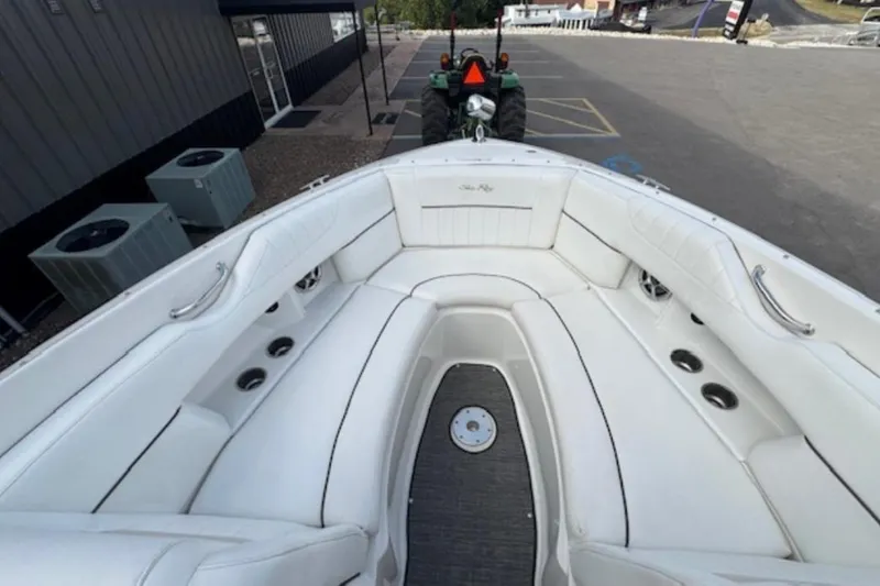 Slide: The Image of 2008 Sea Ray 270 SLX boat with spacious white seating and cup holders. - 14