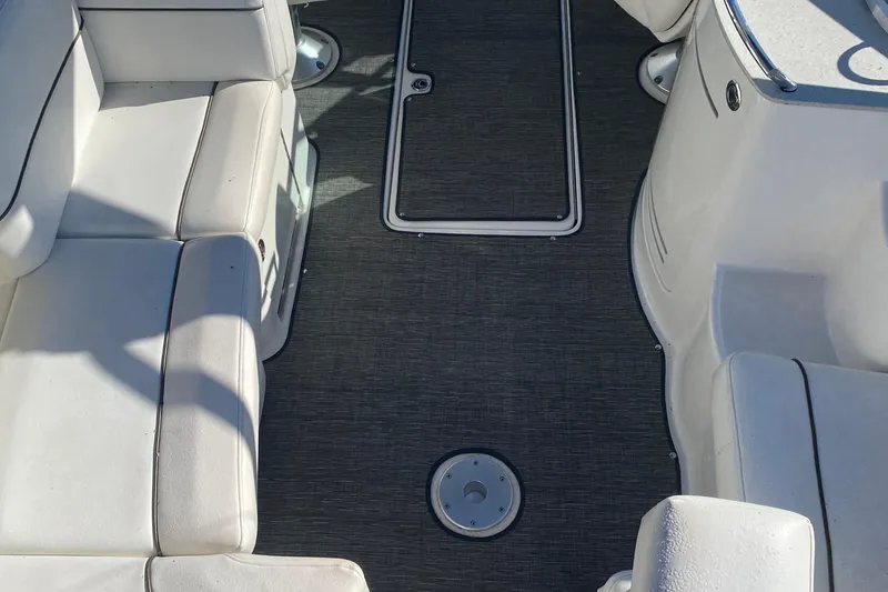 Slide: The Image of Interior of 2008 Sea Ray 270 SLX boat with white seating and gray flooring. - 6