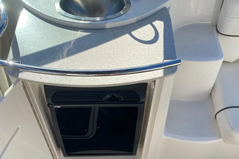 Slide: The Image of 2008 Sea Ray 270 SLX boat interior with sink and mini fridge. - 7