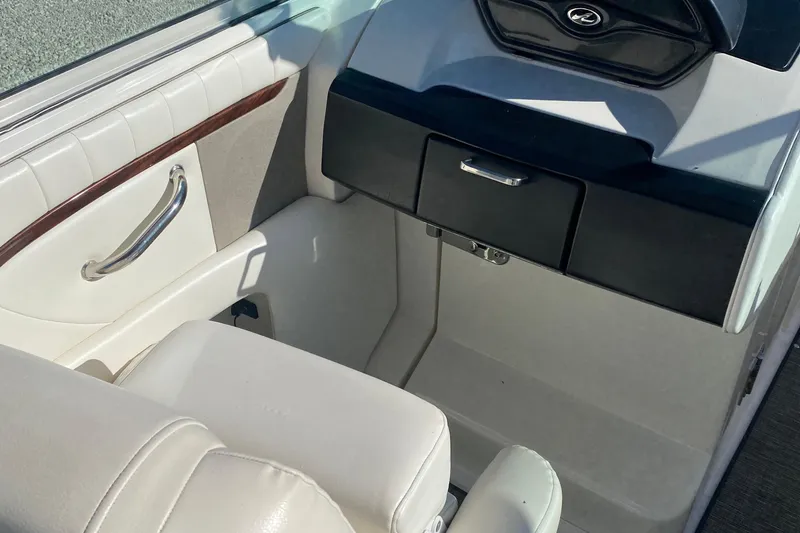 Slide: The Image of Interior of 2008 Sea Ray 270 SLX boat, featuring white seating and sleek design. - 8