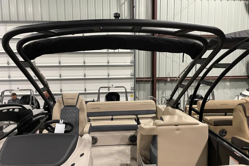 Slide: The Image of 2026 Harris Grand Mariner 230 SL pontoon boat interior with beige seating and black canopy. - 15