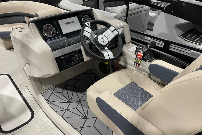 Slide: The Image of 2026 Harris Grand Mariner 230 SL boat interior with modern steering and dashboard. - 20