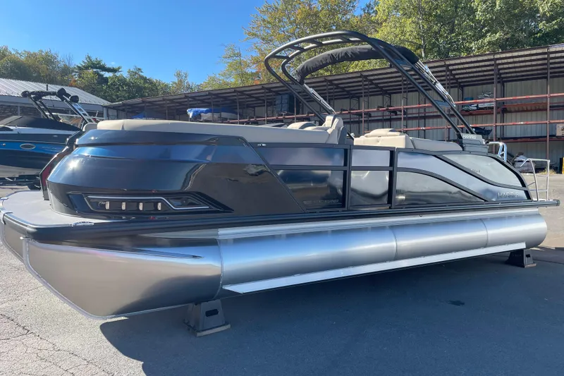 Slide: The Image of 2026 Harris Grand Mariner 230 SL pontoon boat in a marina setting. - 3
