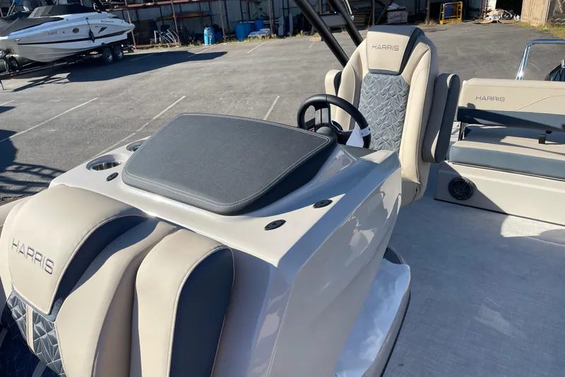 Slide: The Image of 2026 Harris Grand Mariner 230 SL boat interior with luxury seating and steering console. - 8