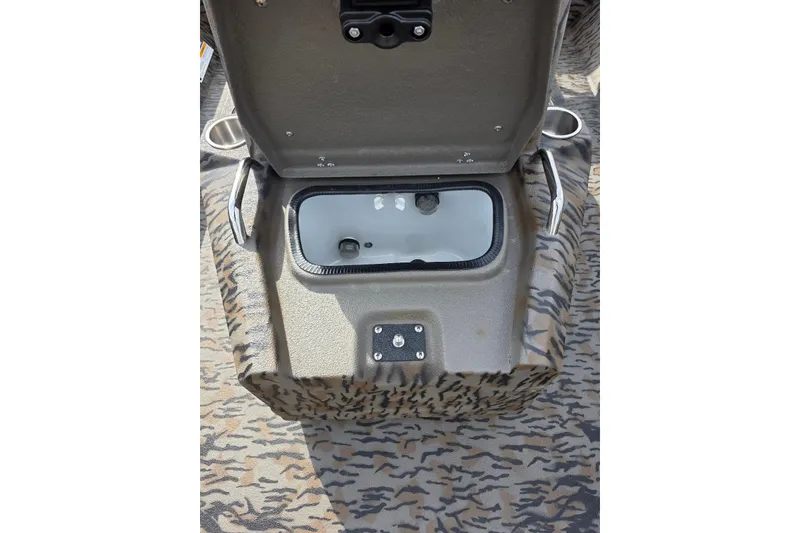 Slide: The Image of Open storage compartment in 2026 Xpress H22B Bay boat with camouflage pattern. - 16