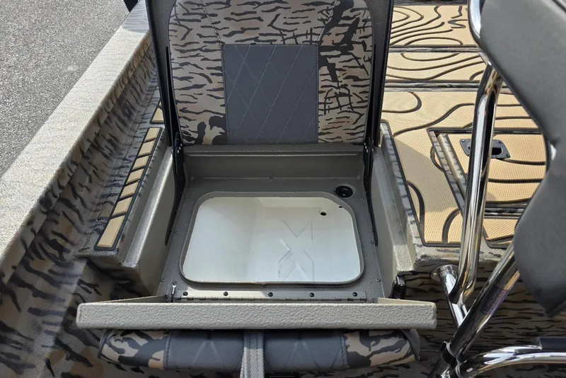 Slide: The Image of 2026 Xpress H22B Bay boat seat storage compartment with camouflage design. - 22
