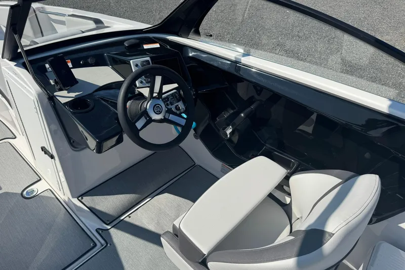 Slide: The Image of 2026 Yamaha Boats AR220 cockpit with steering wheel and modern controls. - 12
