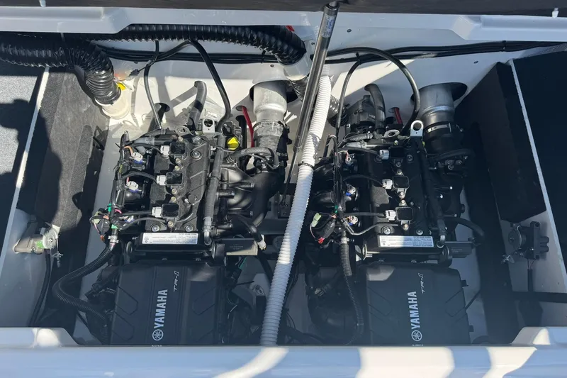 Slide: The Image of 2026 Yamaha AR220 boat engine compartment with dual Yamaha TR-1 engines. - 8