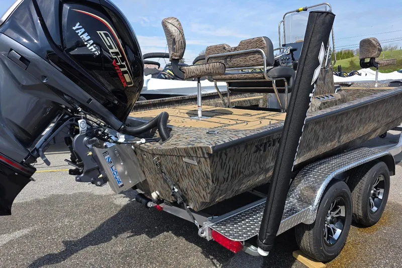 Slide: The Image of 2026 Xpress H22B Bay boat with Yamaha engine on a trailer. - 11