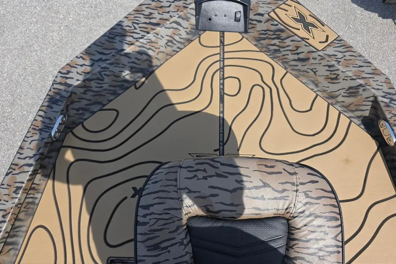 Slide: The Image of 2026 Xpress H22B Bay boat interior with camouflage and contour design. - 17