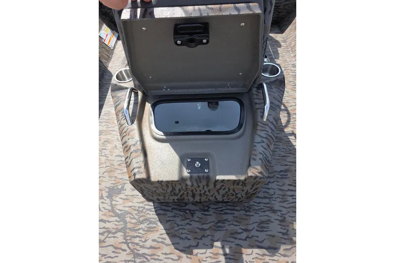 Slide: The Image of Open storage compartment on 2026 Xpress H22B Bay boat with camouflage pattern. - 22