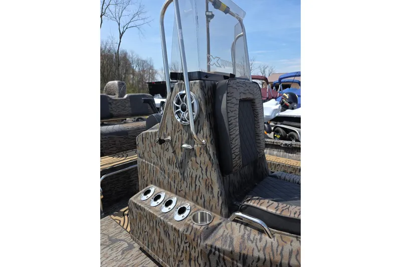 Slide: The Image of 2026 Xpress H22B Bay boat interior with camouflage design and modern console features. - 23