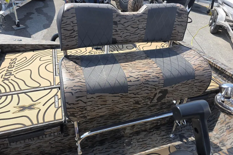 Slide: The Image of 2026 Xpress H22B Bay boat with camo seating and deck design. - 25