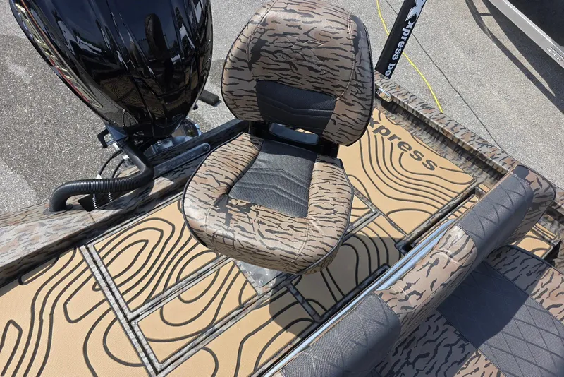 Slide: The Image of 2026 Xpress H22B Bay boat interior with patterned seats and flooring design. - 33