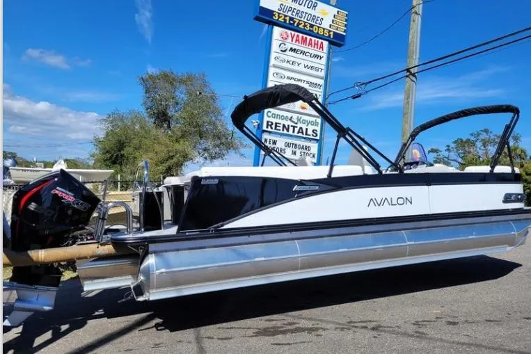 The Image of 2025 Avalon 2585 Quad Lounger pontoon boat displayed at rental store. - 1