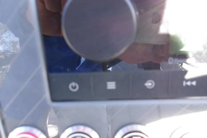 Slide: The Image of Close-up of Avalon 2585 Quad Lounger 2025 dashboard controls with buttons and display. - 15