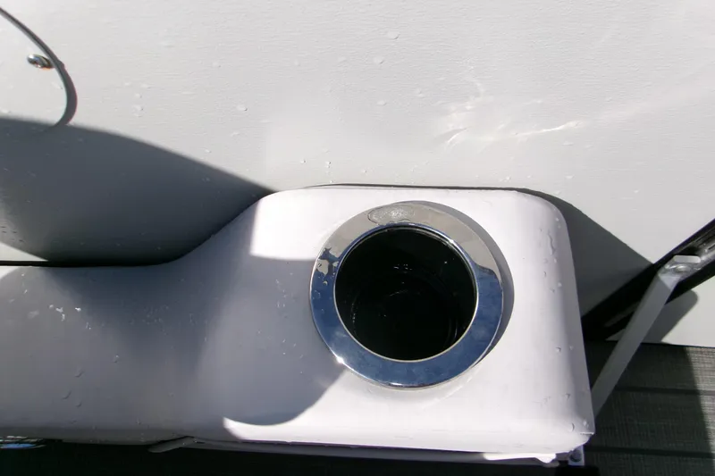 Slide: The Image of Cup holder on 2025 Avalon 2585 Quad Lounger boat, featuring sleek design and water droplets. - 17